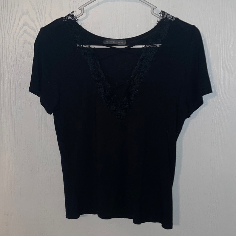 Black v-neck t-shit with criss cross laze design. Size S